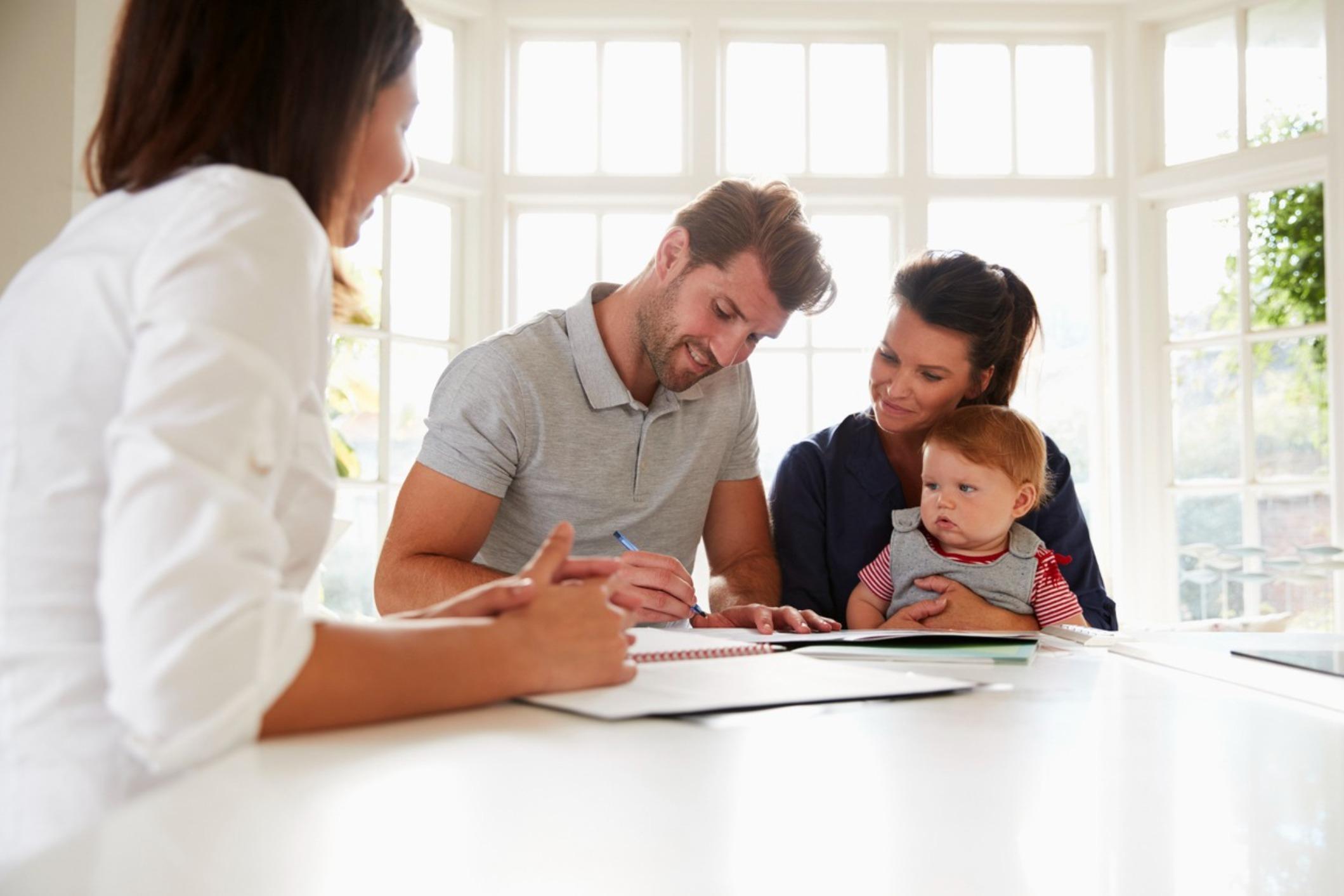 Family discussing life insurance coverage with an insurance agent